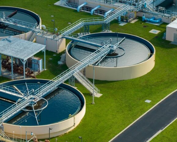 Aerial view of water treatment factory at city wastewater cleaning facility. Purification process of removing undesirable chemicals, suspended solids and gases from contaminated liquid