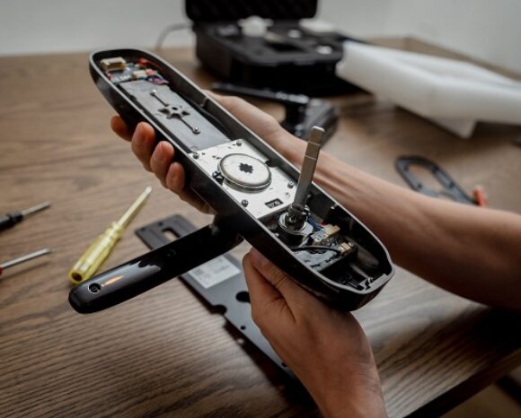 A technician assembles and installs smart electronic door lock for house protection