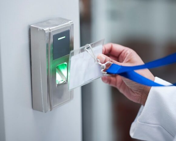 Hand, key card and fingerprint for security door