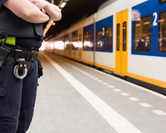 Police officer guarding a train station